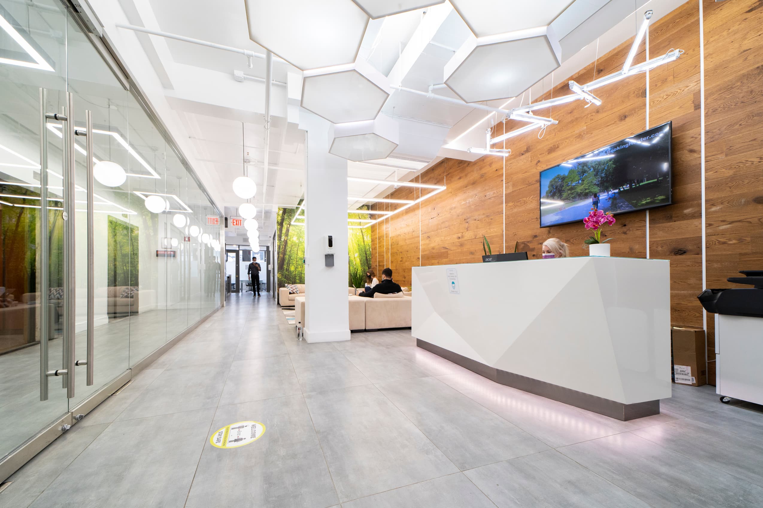 EONY's Midtown office floor, with the kitchenette and lounge off the main corridor